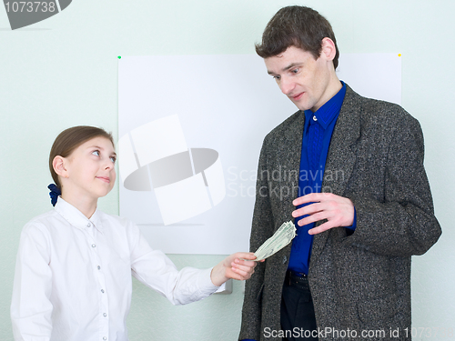 Image of Girl stretches money to the guy