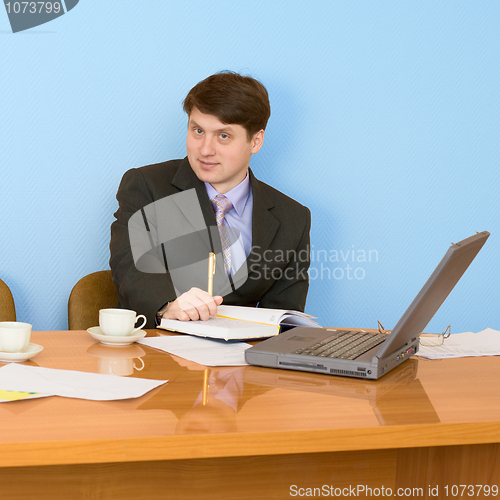 Image of Business team sits at the table