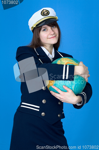 Image of Girl in uniform embrace globe