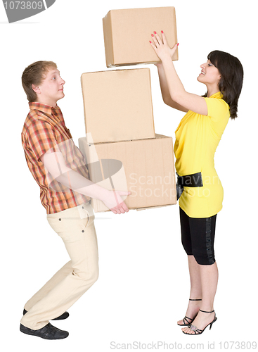 Image of Girl loads the man with cardboard boxes