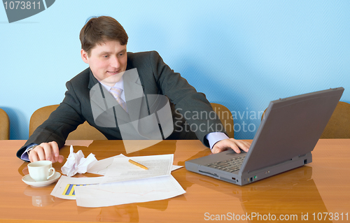 Image of Businessman on a workplace with the laptop