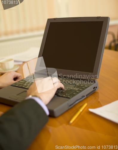 Image of Business people planning on the laptop