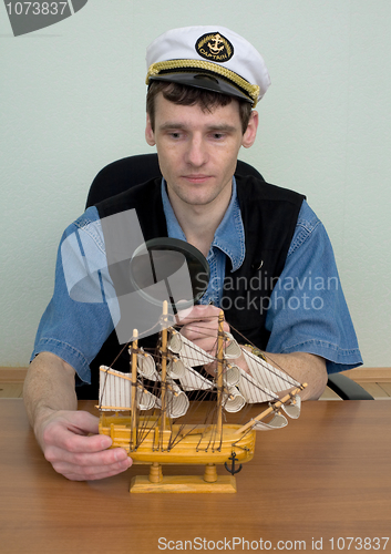 Image of Man in uniform cap with sailer