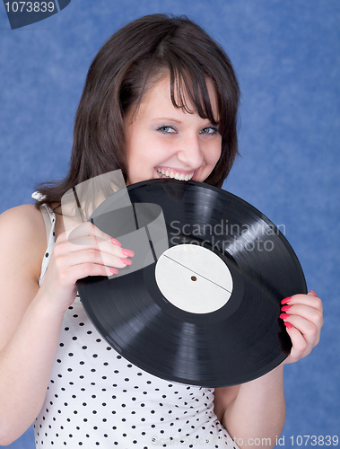 Image of Young woman and vinyl record