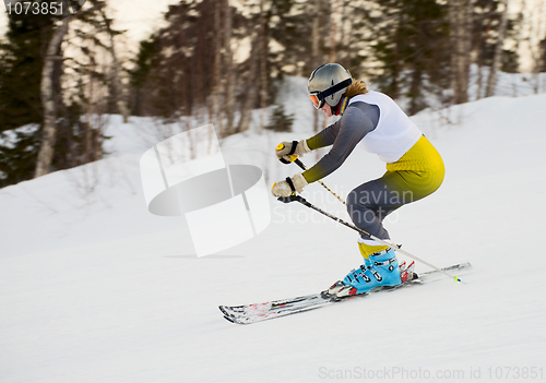 Image of Woman rushing on skis