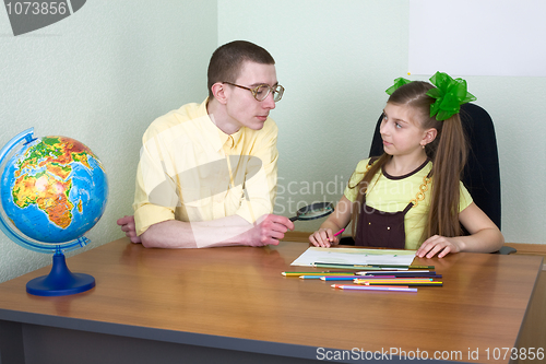 Image of Girl and brother with color pencils