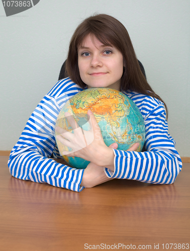 Image of Girl in a stripped vest and globe