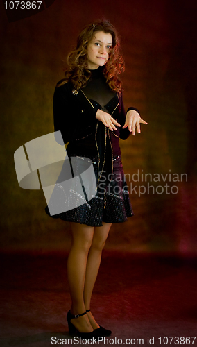 Image of Beauty girl in black on dark background