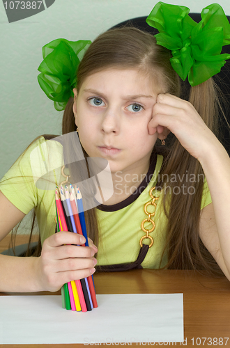 Image of Girl with colour pencils in hands