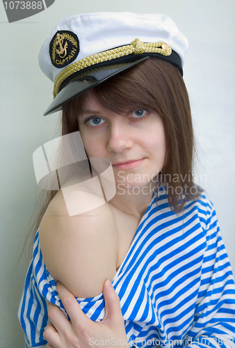 Image of Beautiful girl in a stripped vest and cap