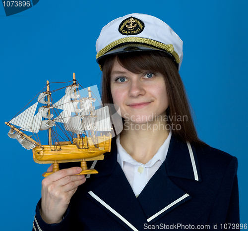 Image of Woman with uniform cap and the ship