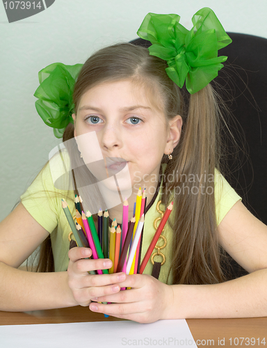 Image of Girl with color pencils in hands