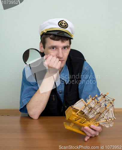 Image of Man in uniform cap with sailer