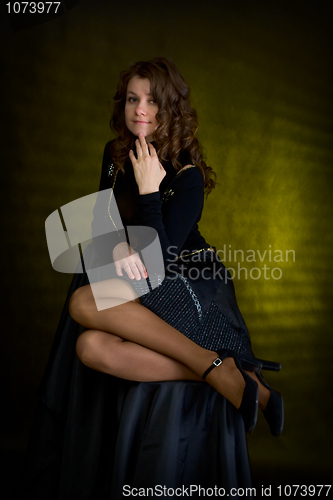 Image of Beauty girl in black on dark background