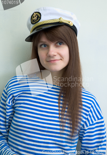 Image of Beautiful girl in a stripped vest and cap