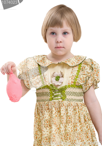 Image of Little girl with blowing off balloon