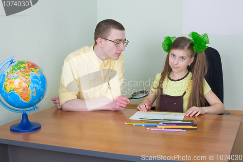 Image of Girl and brother with colour pencils