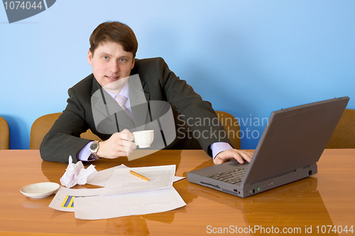 Image of Businessman on a workplace with the laptop