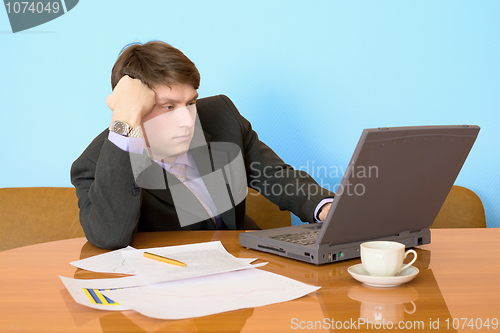 Image of Businessman on a workplace with the laptop