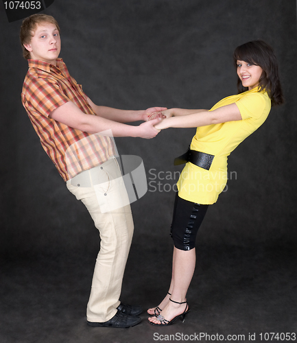 Image of Couple is turned keeping for hands