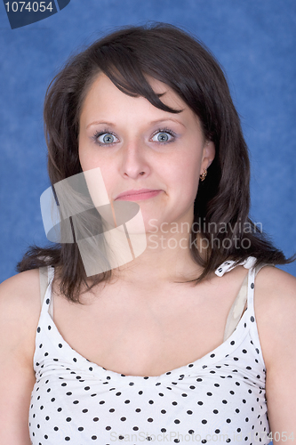 Image of Amazed girl on a blue background