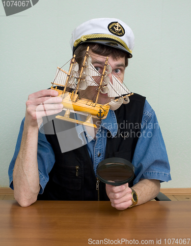 Image of Man in uniform cap with sailer