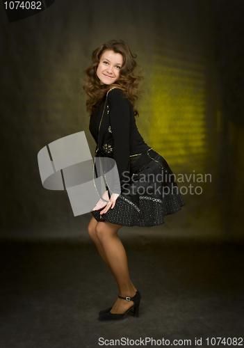 Image of beauty girl in black on dark background