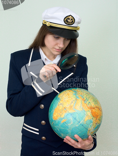 Image of Girl in a sea uniform with the globe