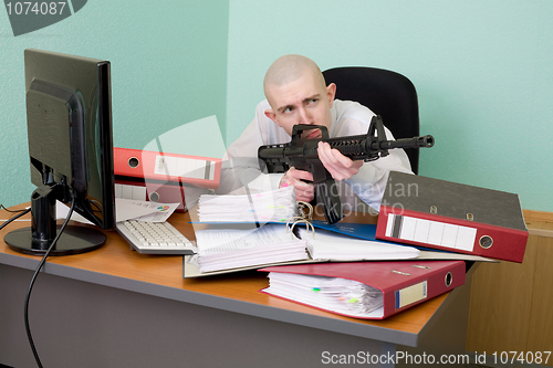 Image of Accountant armed with a rifle