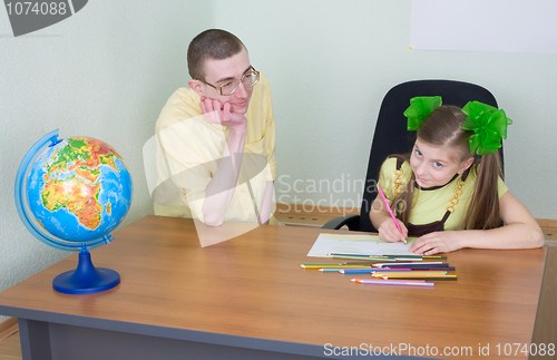 Image of Girl and brother with color pencils