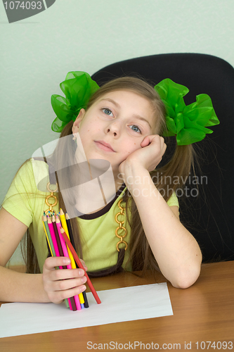 Image of Girl with color pencils in hands