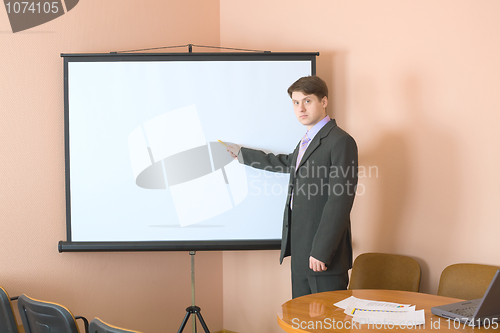 Image of Businessman near the white screen