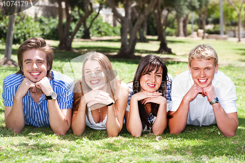 Image of Four teens with hands on their chin