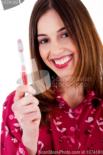Image of young lady posing with toothbrush