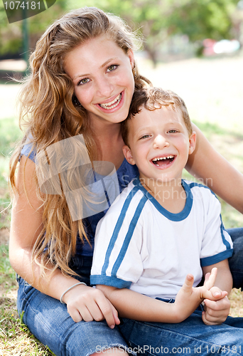 Image of Mother posing with a cute little boy