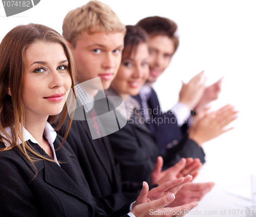 Image of Colleagues applauding during a business meeting