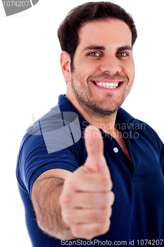 Image of young man gesturing thumbs up