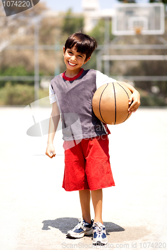 Image of Adorable boy with basketball