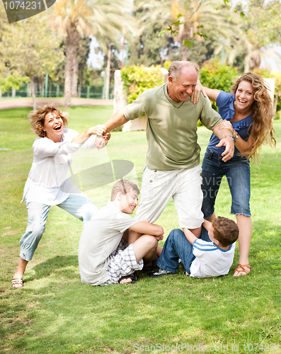 Image of Family holding back grandfather