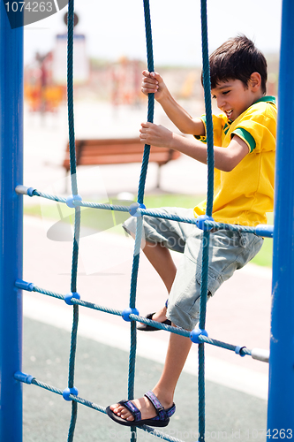 Image of Young boy on playstructure
