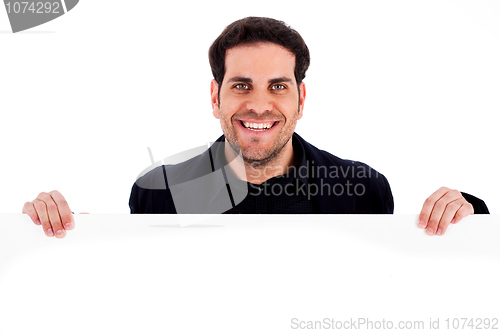 Image of Portrait of a happy male holding blank white card