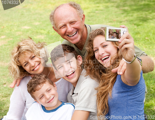 Image of Family outdoors taking self portrait
