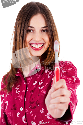 Image of young woman showing toothbrush