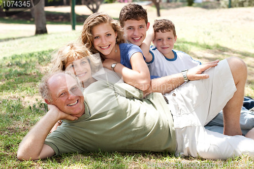 Image of Family lying  in the park