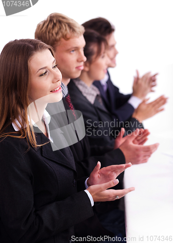 Image of Colleagues applauding during a business meeting