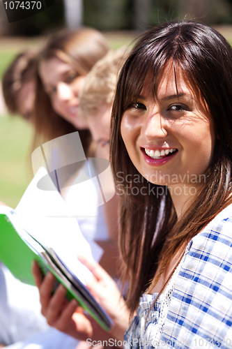 Image of Smiling modern female student in focus