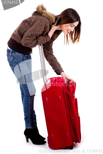 Image of young woman searching her baggage