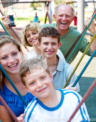 Image of Close-up shot of a family  playing in the playground