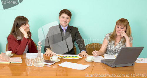 Image of Business team sits at the table