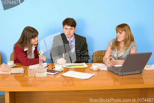 Image of Business team sits at the table